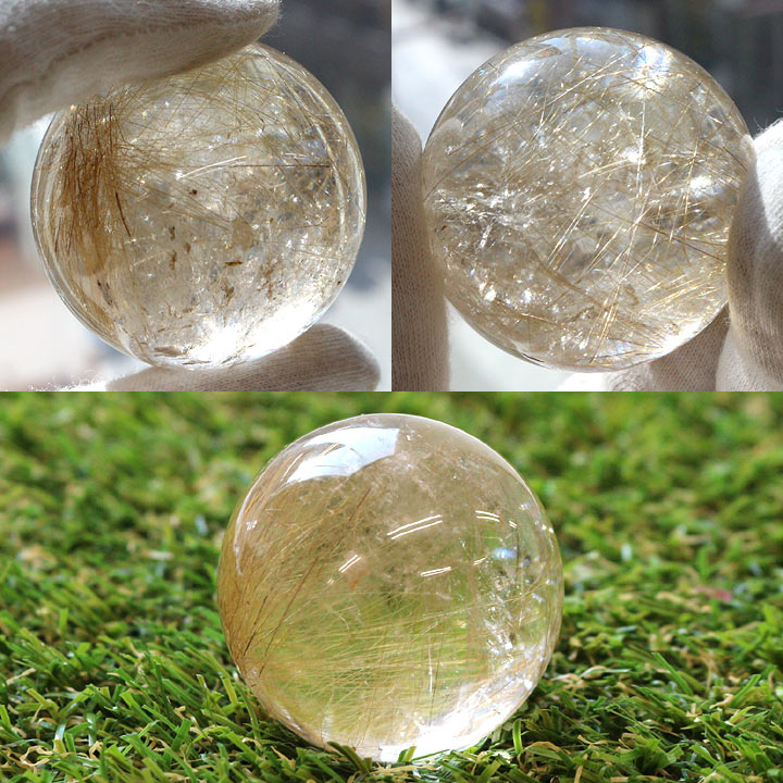 ルチルクォーツ 約42mm球（天然石 パワーストーン 丸玉 球体）手に持ったイメージとグリーンに置いたイメージ